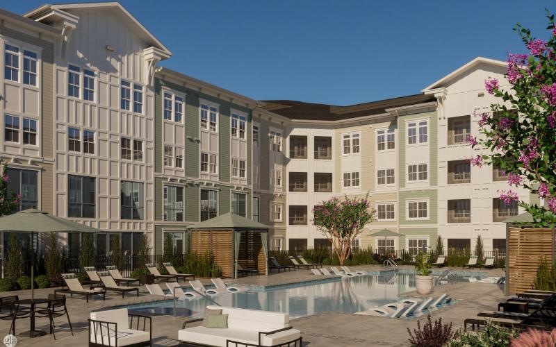 a courtyard with tables and chairs and buildings in the background
